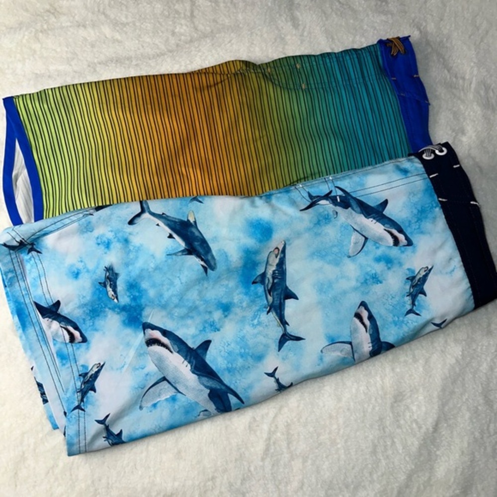 A pair of Wonder Nation swim trunks. Both size Men’s 18.